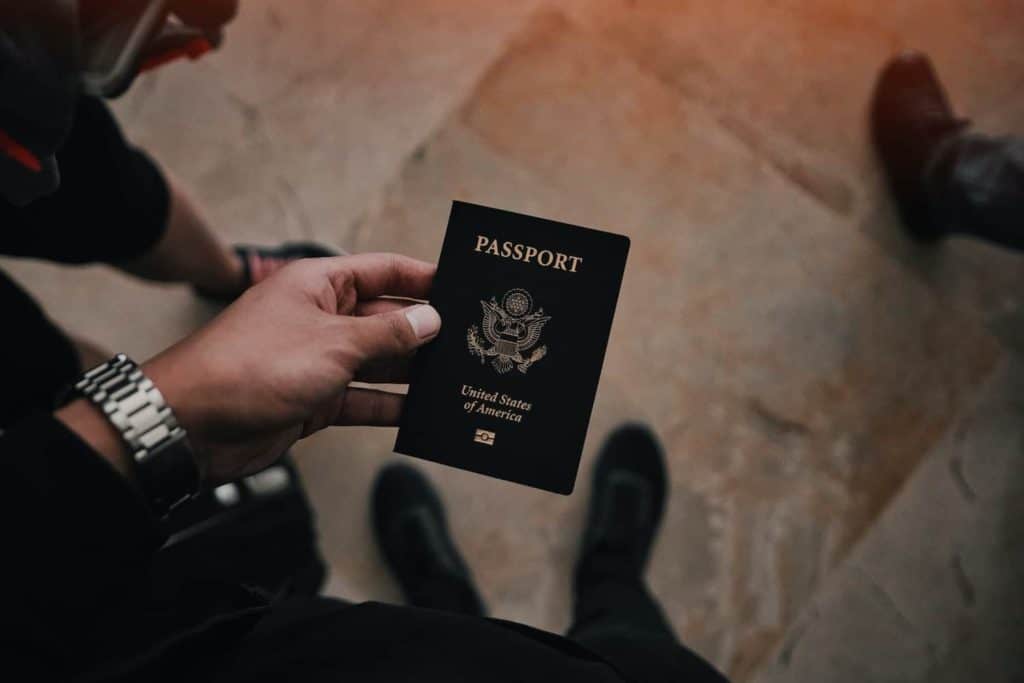 usa passport with hand