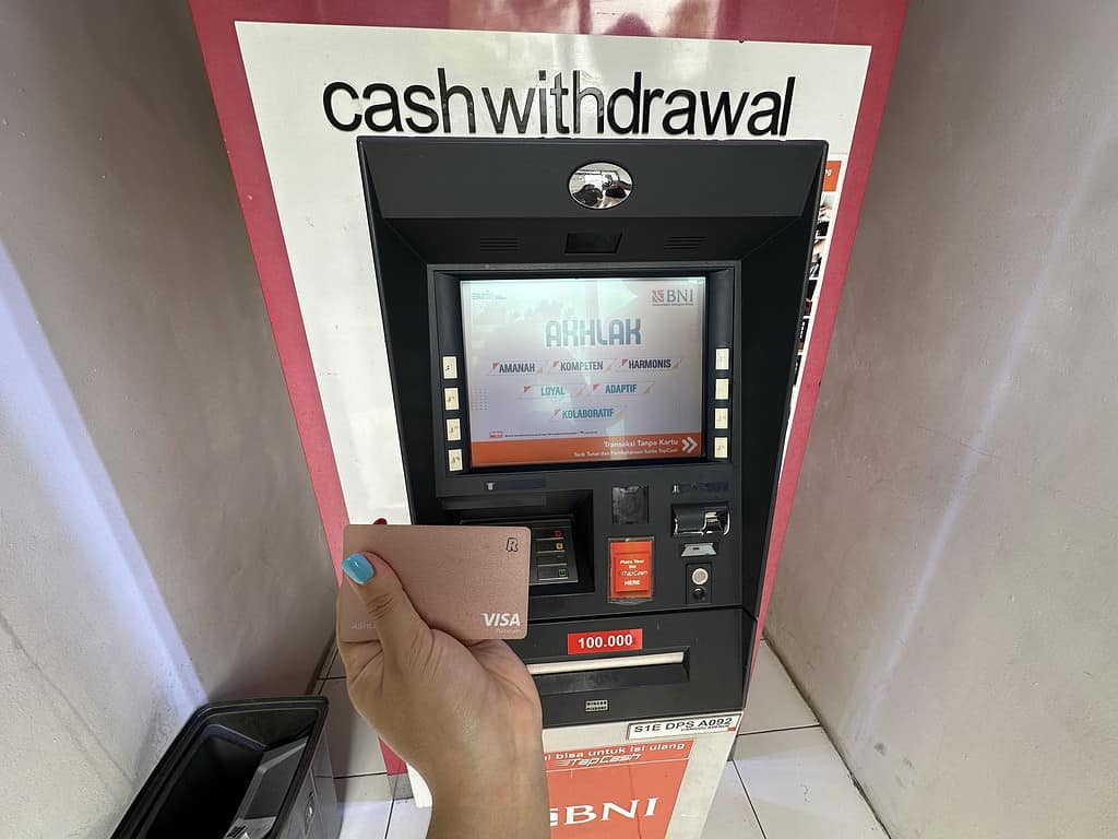 ashley using personal revolut card at atm in bali